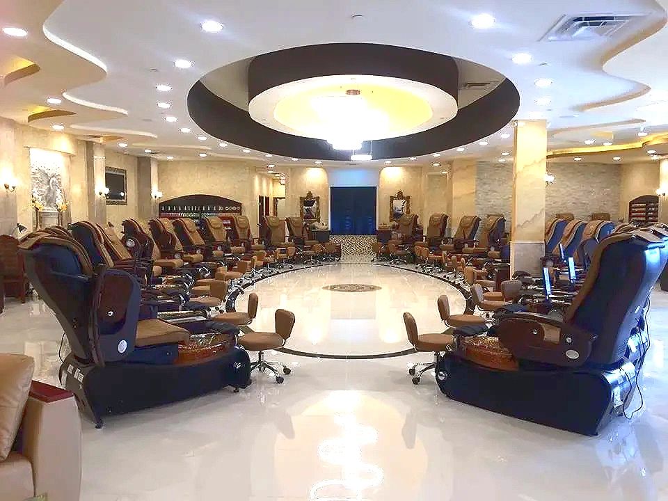 Salon interior with a domed ceiling feature, cove lighting and recessed downlights throughout.